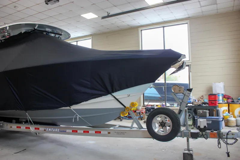  Yacht Photos Pics 2018 Sea Hunt Gamefish 30 boat covered on trailer in indoor storage.