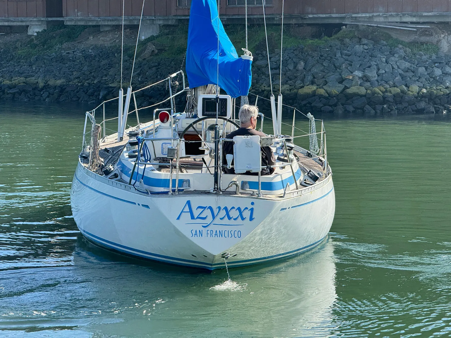 Nautor Swan 38 sailboat from 1974 named Azyxxi, sailing in calm waters.