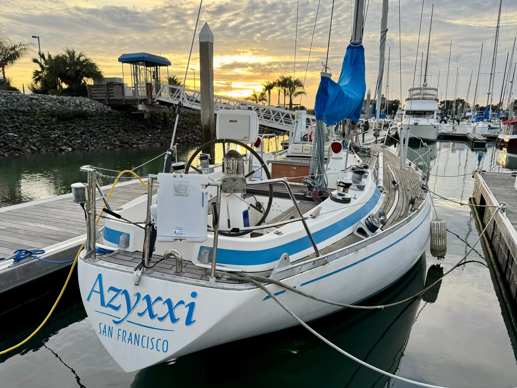 Nautor Swan 38 sailboat docked at sunset, San Francisco marina, 1974 model.