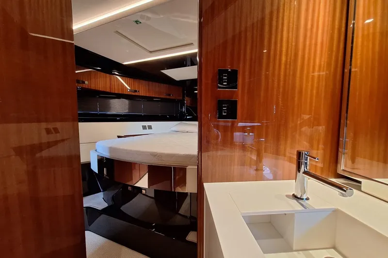  Yacht Photos Pics Luxurious interior of 2022 Riva RIVALE 56 HT yacht with modern wood finishes and sleek design.