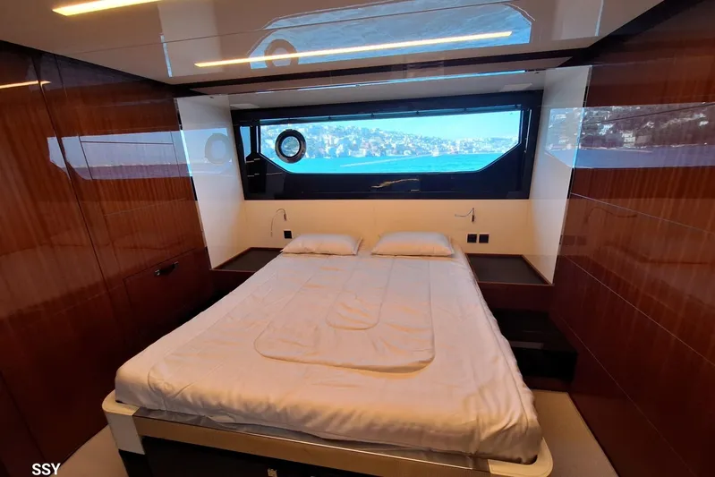  Yacht Photos Pics Luxurious bedroom interior of 2022 Riva RIVALE 56 HT yacht with scenic window view.