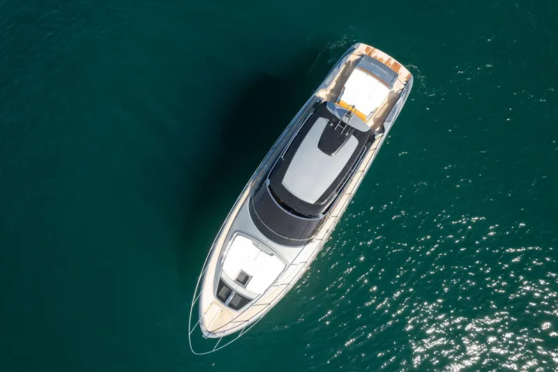  Yacht Photos Pics Aerial view of 2022 Riva RIVALE 56 HT yacht on clear blue water.
