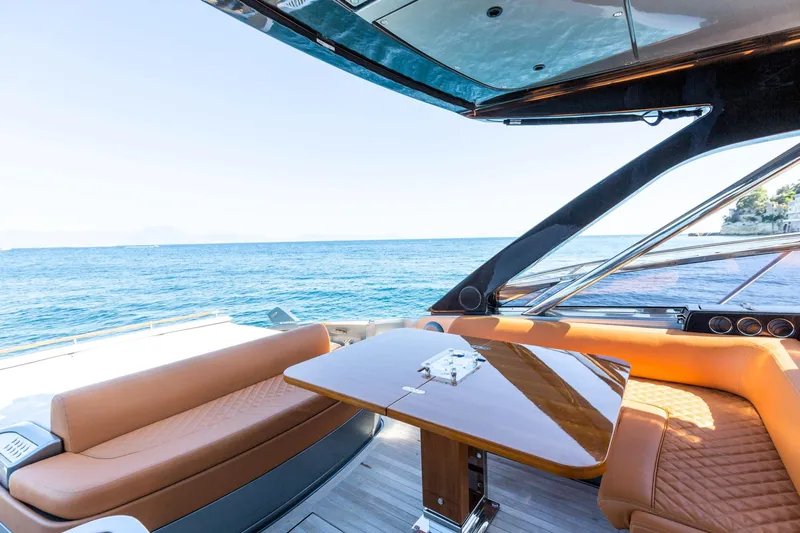  Yacht Photos Pics Luxurious 2022 Riva RIVALE 56 HT yacht interior with ocean view and elegant seating.