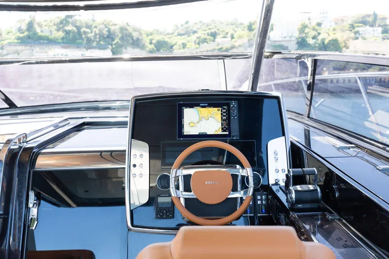  Yacht Photos Pics Cockpit of 2022 Riva RIVALE 56 HT yacht with modern navigation system.