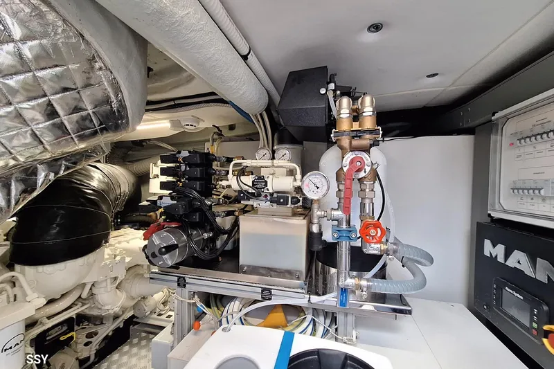  Yacht Photos Pics Engine room of 2022 Riva RIVALE 56 HT yacht, showcasing mechanical components and gauges.