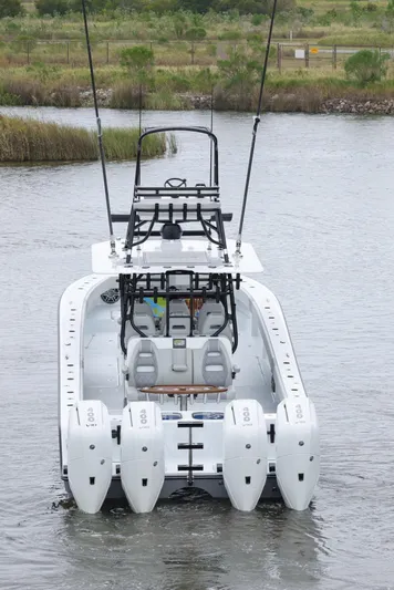 Brand New Yacht Photos Pics Freeman 42 LR 2025 boat with four engines on a calm waterway.