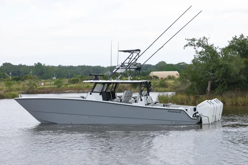 Brand New Yacht Photos Pics Freeman 42 LR 2025 boat on calm water, featuring dual engines and sleek design.