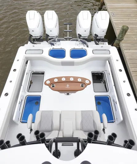 Brand New Yacht Photos Pics Freeman 42 LR 2025 boat with four engines, spacious deck, and fishing rod holders.