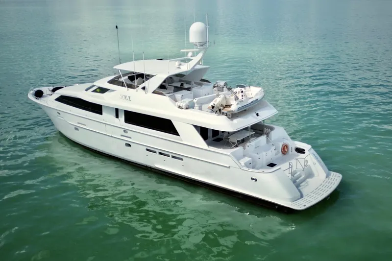 Soul Yacht Photos Pics Luxurious 2002 Hatteras 92 Cockpit Motor Yacht on calm waters.