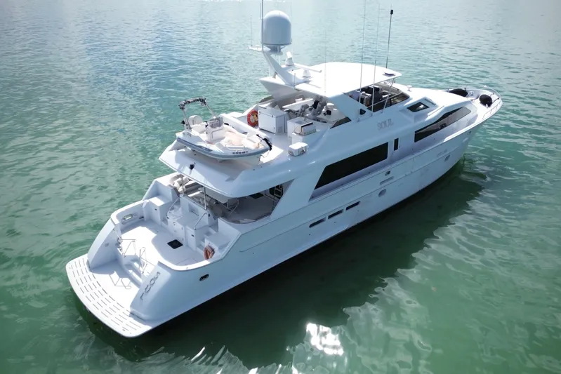 Soul Yacht Photos Pics Luxurious 2002 Hatteras 92 Cockpit Motor Yacht on serene water.