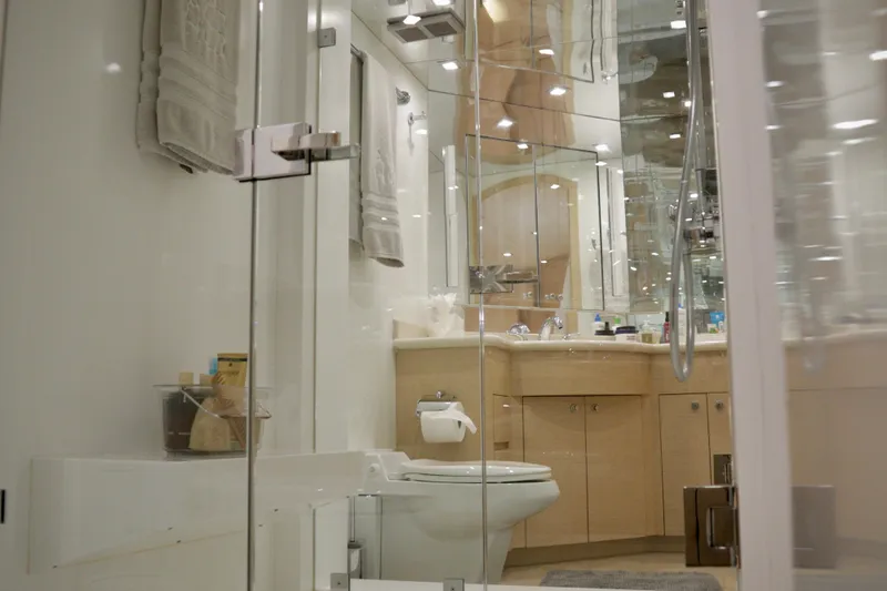 Soul Yacht Photos Pics Luxurious bathroom interior on 2002 Hatteras 92 Cockpit Motor Yacht, featuring modern fixtures and elegant design.