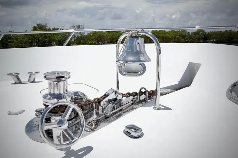 Soul Yacht Photos Pics Chrome anchor winch and bell on 2002 Hatteras 92 Cockpit Motor Yacht deck.