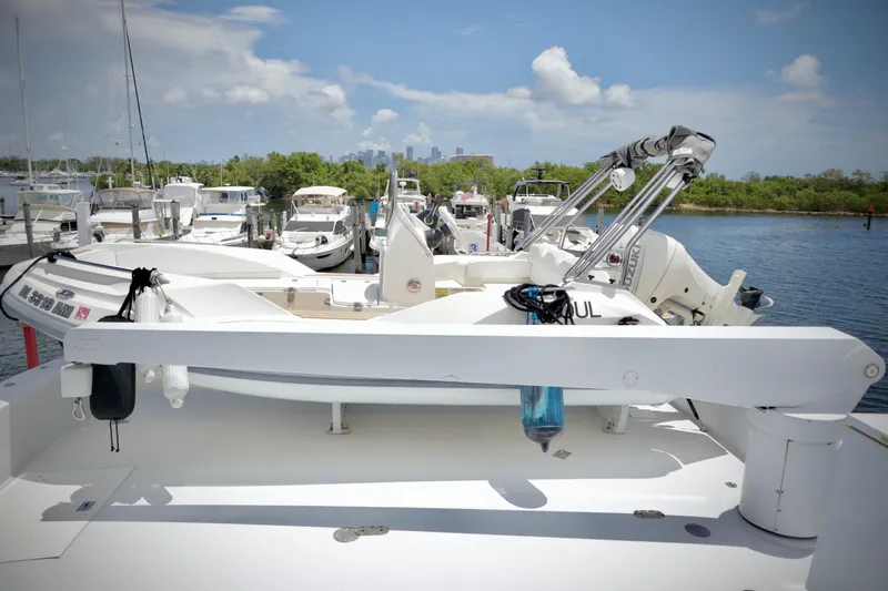 Soul Yacht Photos Pics Hatteras 92 Cockpit Motor Yacht 2002 docked, featuring a spacious deck and tender.