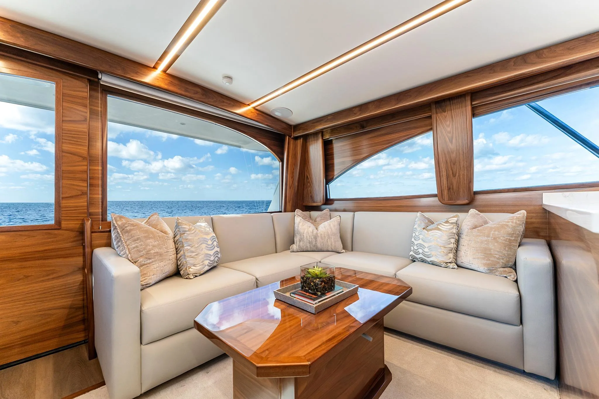 Luxurious interior of 2026 Viking 50 Convertible yacht with ocean view.