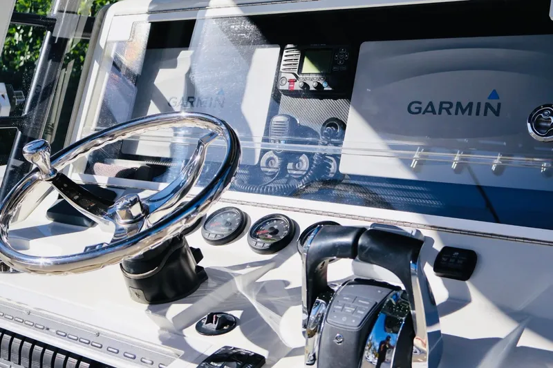  Yacht Photos Pics 2019 SeaVee 370Z boat dashboard with Garmin navigation system and steering wheel.