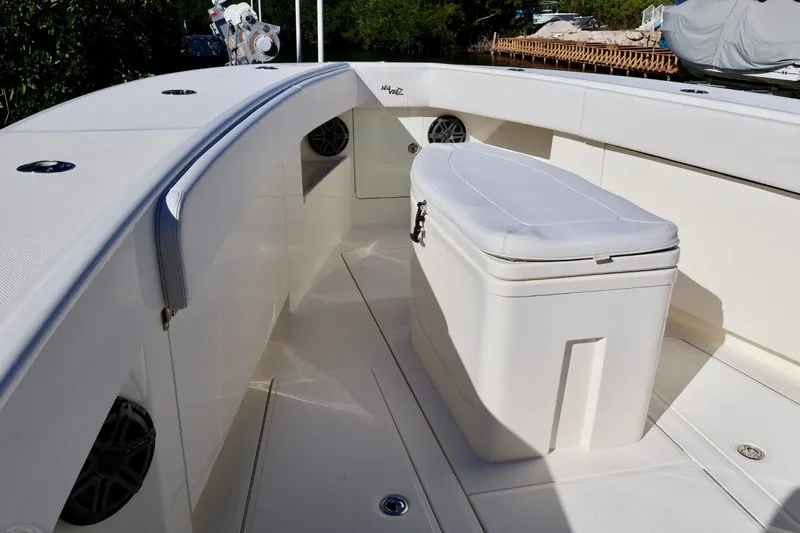  Yacht Photos Pics 2019 SeaVee 370Z boat interior with seating and storage, featuring sleek white design.