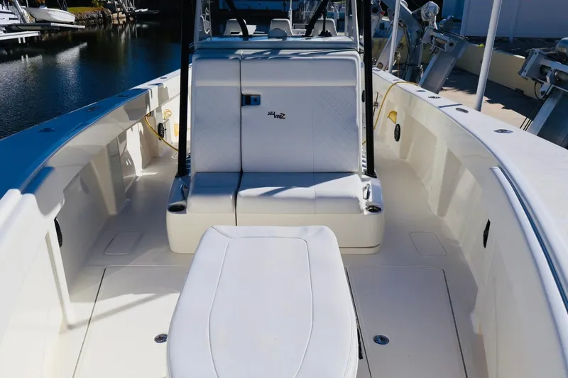  Yacht Photos Pics 2019 SeaVee 370Z boat interior with seating, docked by the water.