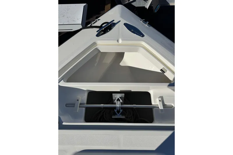  Yacht Photos Pics 2019 SeaVee 370Z boat storage compartment with open hatch and visible rope.