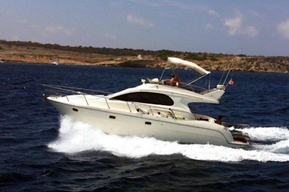 2005 Intermare 37 FLY CRUISER yacht cruising on open water.