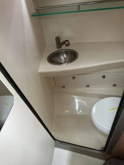  Yacht Photos Pics 2016 Boston Whaler 285 Conquest bathroom with sink and toilet.