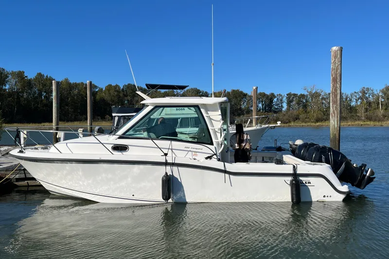  Yacht Photos Pics 2016 Boston Whaler 285 Conquest boat docked on a sunny day.