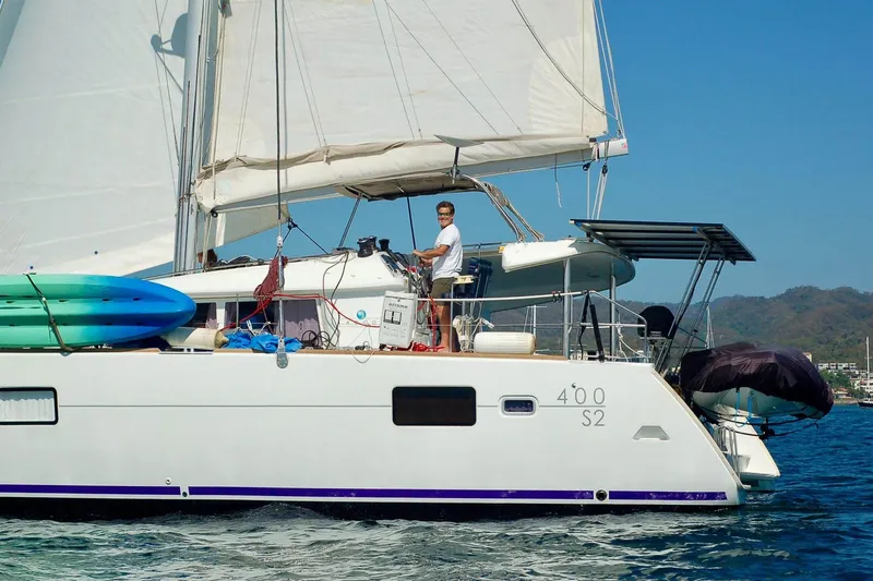 Arias Song Yacht Photos Pics 2016 Lagoon 400 S2 catamaran sailing with kayaks on deck.