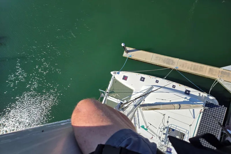 Arias Song Yacht Photos Pics Aerial view of 2016 Lagoon 400 S2 catamaran docked in green water.