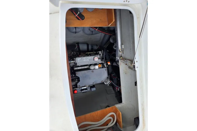 Arias Song Yacht Photos Pics Engine compartment of 2016 Lagoon 400 S2 catamaran, showcasing mechanical components and wiring.