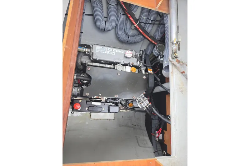 Arias Song Yacht Photos Pics Engine compartment of 2016 Lagoon 400 S2 catamaran with visible hoses and components.