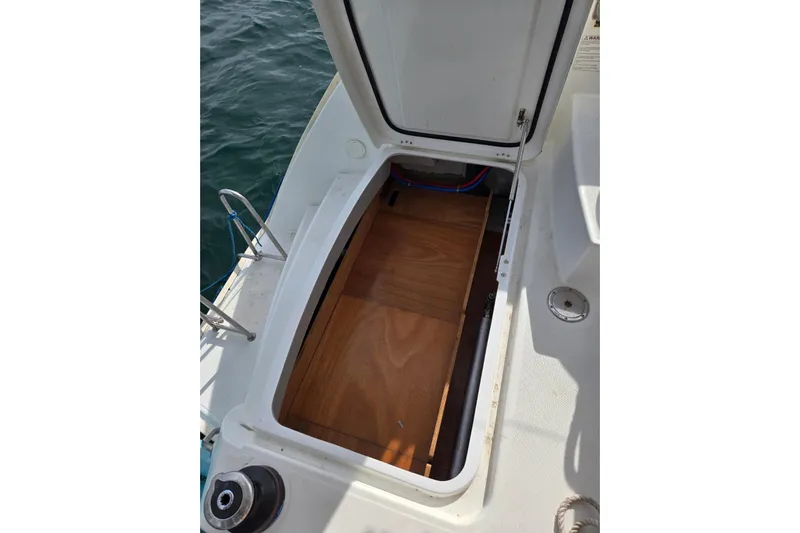 Arias Song Yacht Photos Pics Open storage compartment on 2016 Lagoon 400 S2 catamaran, showing interior details.