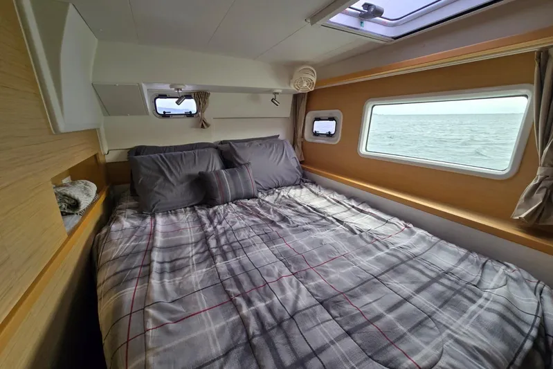 Arias Song Yacht Photos Pics Cozy bedroom interior of 2016 Lagoon 400 S2 yacht with ocean view.