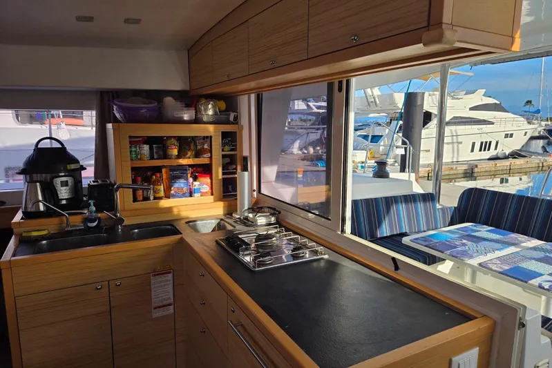 Arias Song Yacht Photos Pics Modern kitchen interior of 2016 Lagoon 400 S2 yacht with marina view.
