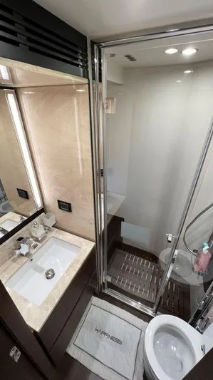  Yacht Photos Pics Luxurious bathroom in 2018 Azimut 72 yacht with modern fixtures and elegant design.