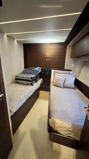  Yacht Photos Pics Twin cabin interior of 2018 Azimut 72 yacht with modern design and luggage.