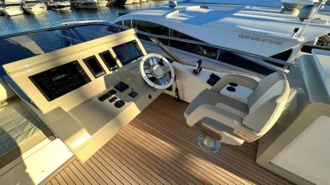  Yacht Photos Pics 2018 Azimut 72 yacht helm with modern controls and luxurious seating, docked at marina.