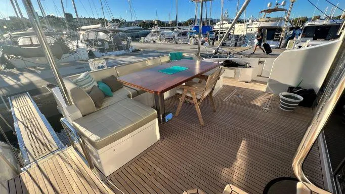  Yacht Photos Pics Luxurious 2018 Azimut 72 yacht deck with seating and dining area in a marina setting.