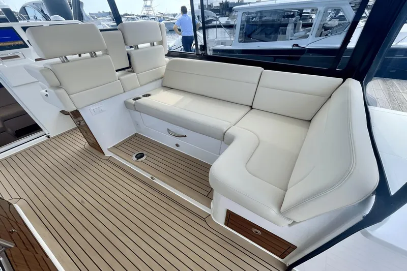  Yacht Photos Pics Luxurious seating area on 2024 MJM 4 yacht with elegant wood flooring.