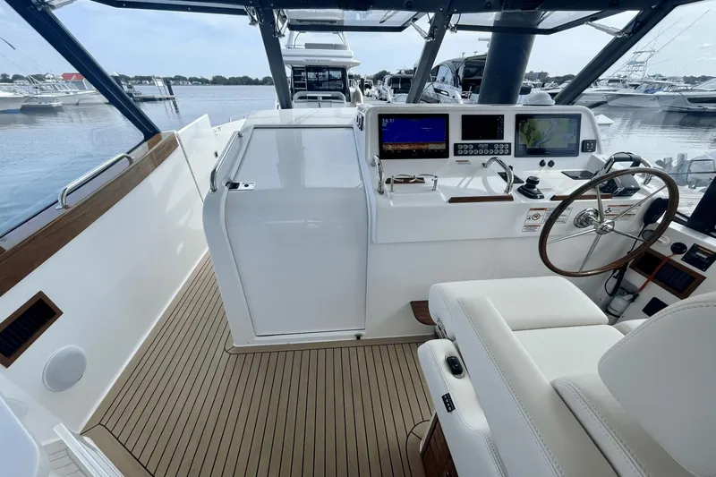  Yacht Photos Pics 2024 MJM 4 yacht cockpit with modern navigation equipment and luxurious seating.