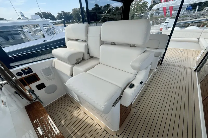  Yacht Photos Pics Luxurious seating on 2024 MJM 4 yacht, featuring elegant white upholstery and sleek design.