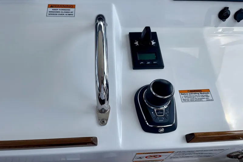  Yacht Photos Pics Control panel of 2024 MJM 4 boat with joystick and warning labels.