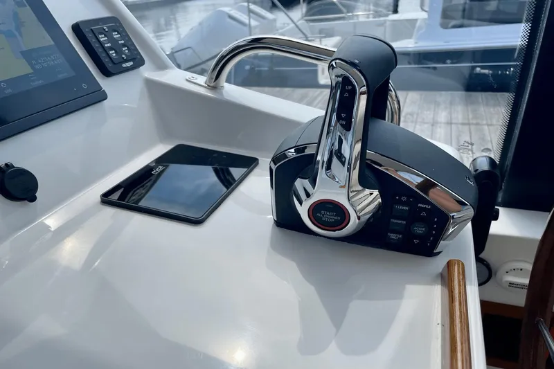  Yacht Photos Pics 2024 MJM 4 boat control panel with throttle and navigation screen.