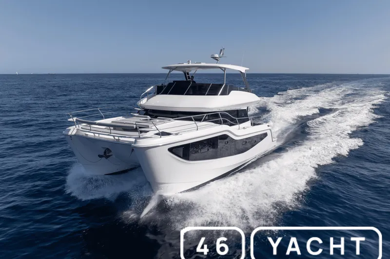  Yacht Photos Pics Aquila 2026 New model yacht cruising on open sea, showcasing sleek design and performance.