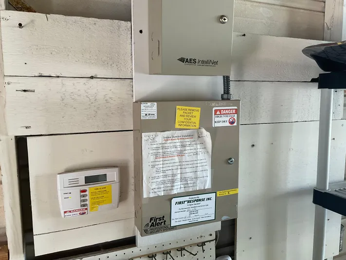  Yacht Photos Pics Electrical control panel in a 1980 custom boathouse with safety labels and instructions.