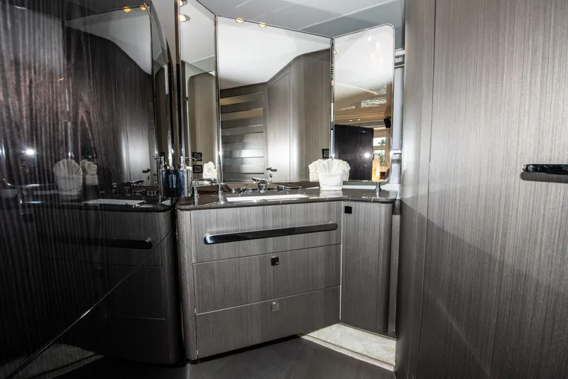 Another Chance III Yacht Photos Pics Luxurious bathroom interior of 2021 Azimut S7 yacht with modern wood finish and mirrors.