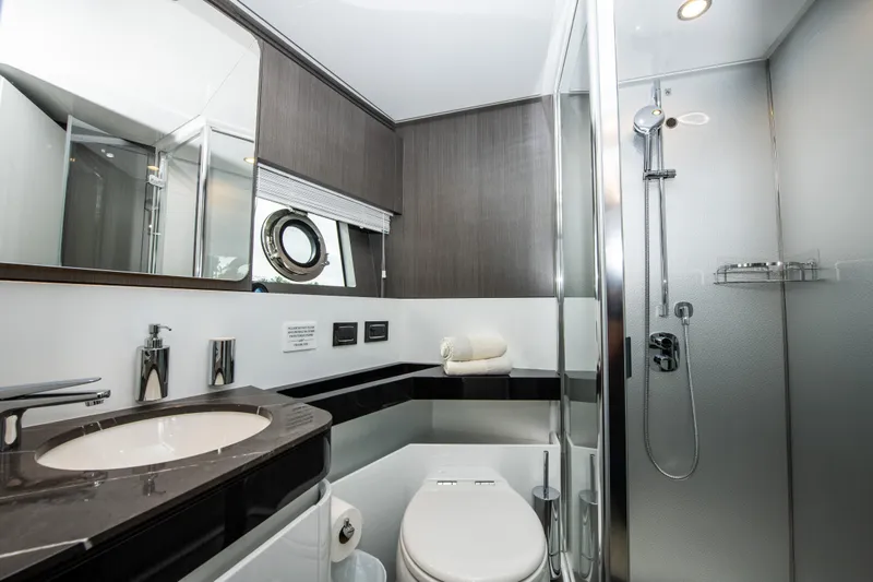 Another Chance III Yacht Photos Pics Luxurious bathroom in 2021 Azimut S7 yacht with modern fixtures and sleek design.
