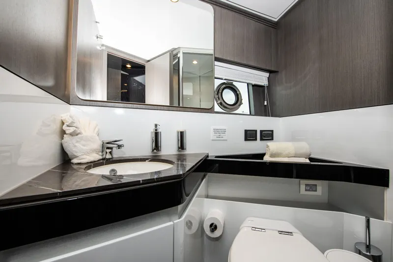 Another Chance III Yacht Photos Pics Luxurious bathroom in 2021 Azimut S7 yacht with modern fixtures and elegant design.