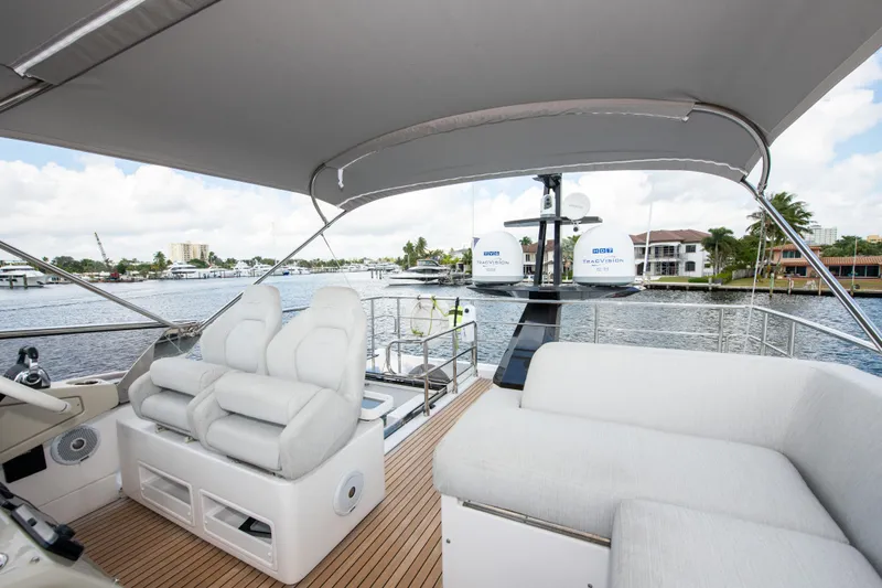 Another Chance III Yacht Photos Pics Luxurious 2021 Azimut S7 yacht interior with plush seating and scenic marina view.