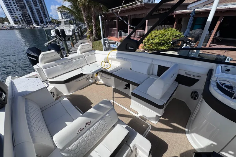  Yacht Photos Pics 2024 Sea Ray SDX 290 Outboard boat interior with luxurious seating and modern design.