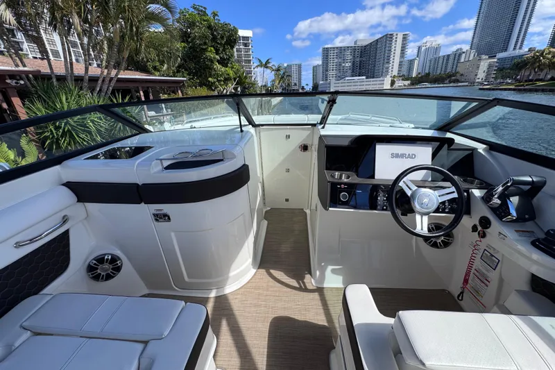  Yacht Photos Pics 2024 Sea Ray SDX 290 Outboard boat interior with modern helm and seating.