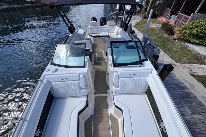  Yacht Photos Pics 2024 Sea Ray SDX 290 Outboard boat docked, featuring spacious seating and modern design.
